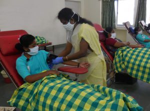 staff giving blood at a CMC Vellore blood camp