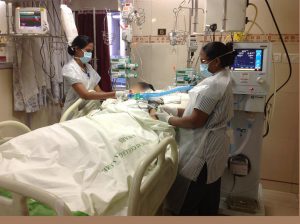 Nurses care for a patient after a liver transplant in ICU 2014