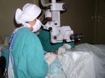 Operating using a microscope to see the eye for fine surgery 2005
